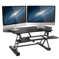 Mount-It! 48.5" Electric Standing Desk Converter for Dual Monitors, Motorized Sit Stand Electric Desk Riser with USB Port & Device Slot, Keyboard Tray, Adjustable Height Ergonomic Workstation, Black