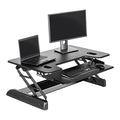 Vari Varidesk Tall 40 Standing Desk Converter for Users Up to 6'6" - Fits Dual Monitors (40" Wide) + Keyboard (28" Deep), 9 Height Settings (4¾" to 23"), Supports 35lbs – Delivers Assembled (Black)