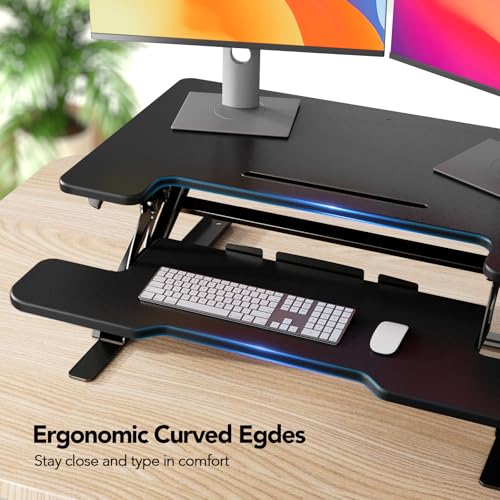 HUANUO 36" Z Shaped Stable Standing Desk Converter, Height Adjustable Sit Stand Up Desk Riser, Dual Monitor and Laptop Workstation with Wide Keyboard Tray, Desk Lifter for Home Office,Black