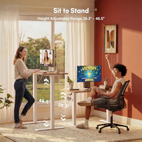 FEZIBO Standing Desk, 48 × 24 Inches Electric Height Adjustable, Sit and Stand Up, Computer Office Desk with Splice Board, White Frame/Maple TOP