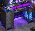 Korfile 47 Inch Gaming Desk with Power Outlets and LED Lights, Reversible Computer Desk with 5 Fabric Storage Drawers, Home Office Desk with Monitor Stand for Working Writing Study, Black
