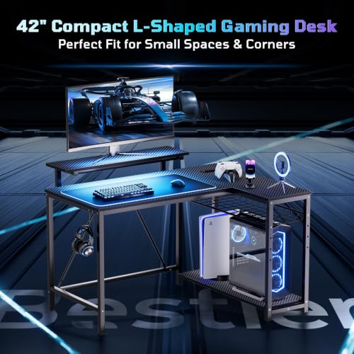 Bestier Gaming Desk with Power Outlets, 42" L-Shaped Computer Desk with LED Lights, Desk with Reversible Storage Shelves & Hooks for Small Spaces, Bedrooms & Offices, Black Carbon Fiber