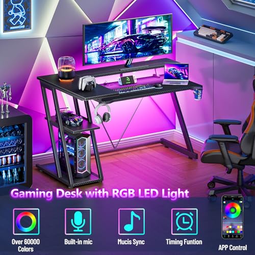 Korfile 40 Inch Gaming Desk with Power Outlet & LED Lights, L Shaped Computer Gaming Table with 3 Tiers Storage Shelves, Corner Gamer Desk with Monitor Stand for Small Space, Carbon Fiber Black